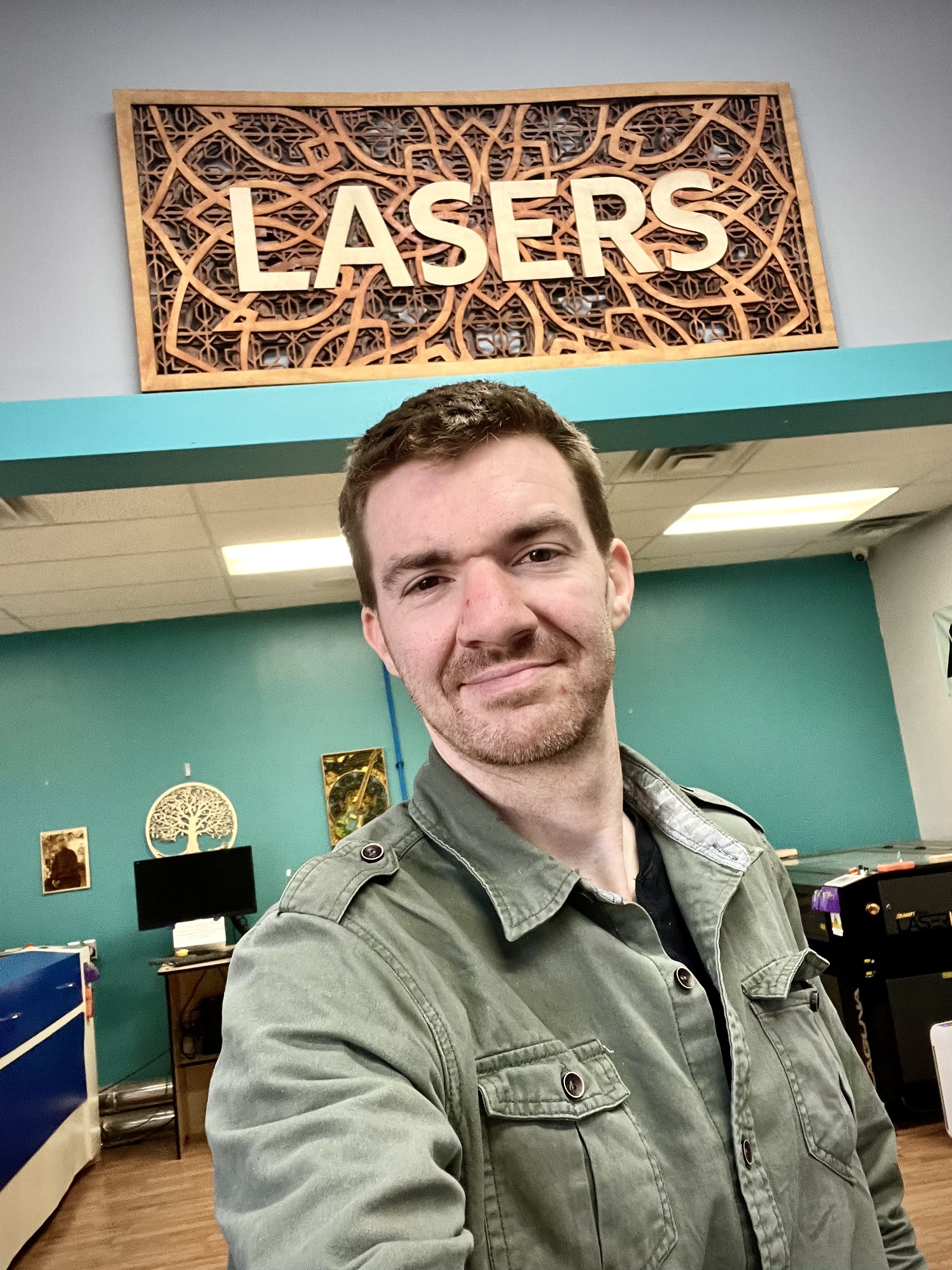 Jonathan at makerspace lasers sign