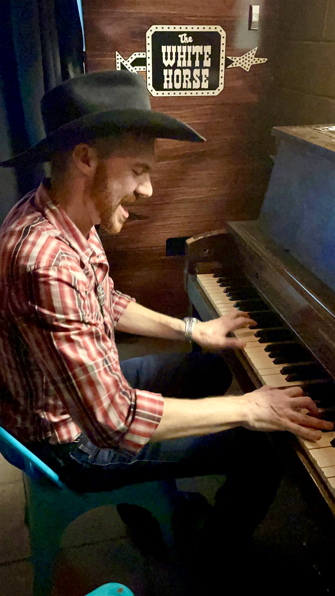 Jonathan at piano cowboy